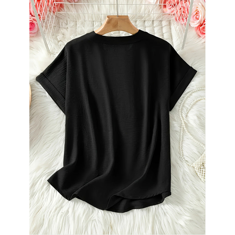 Elegant ensfarvet bluse