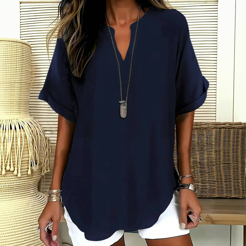Elegant ensfarvet bluse